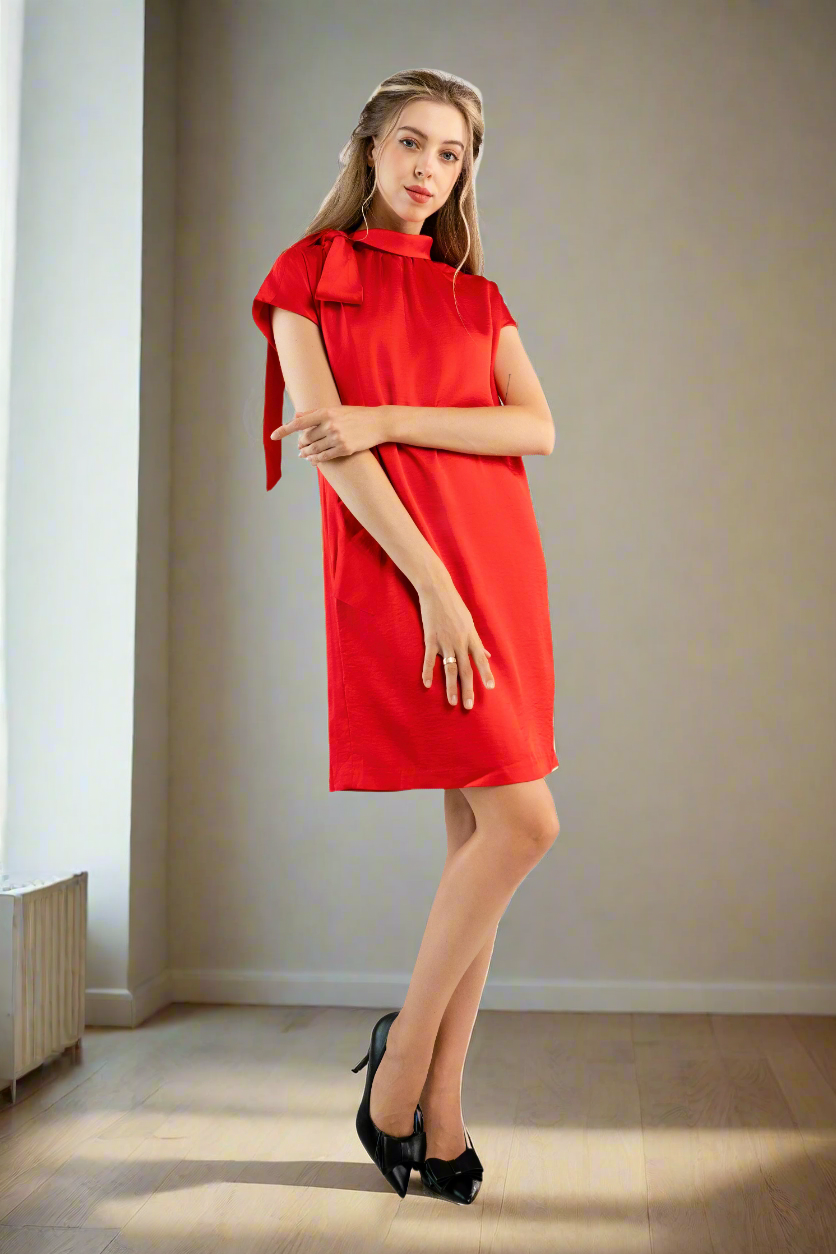 Red satin shift dress with bow on shoulder