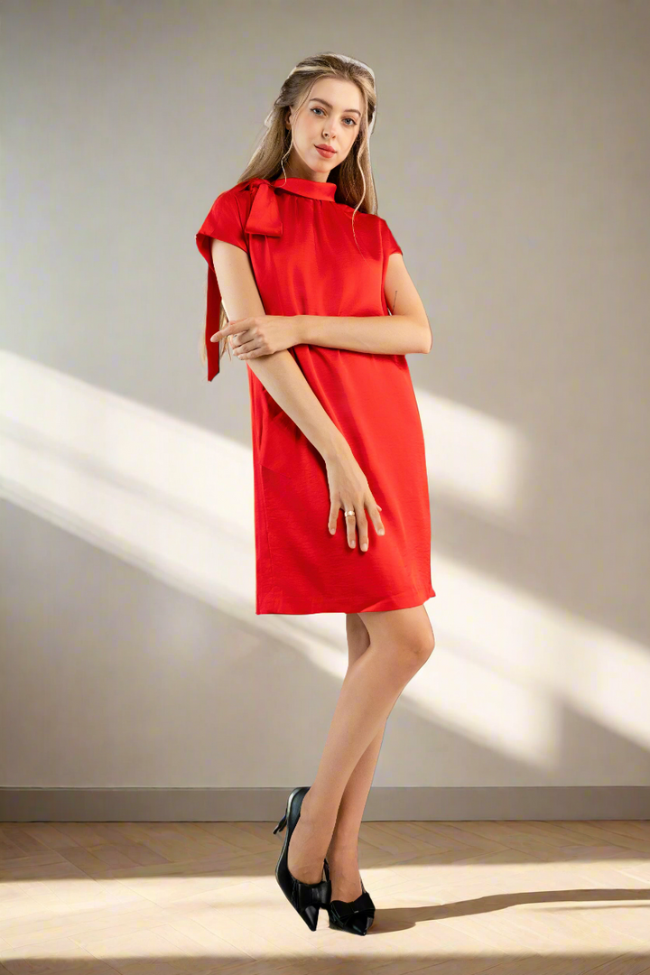 Red satin shift dress with bow on shoulder